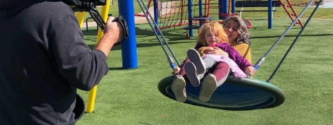 Mom swinging with daughter