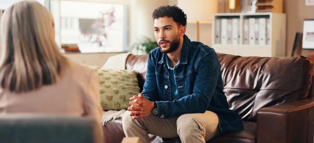 Man talking to therapist